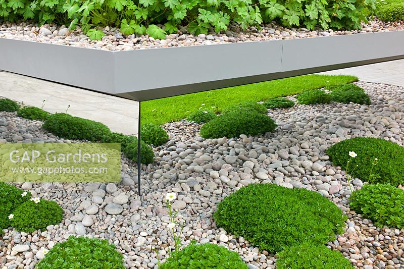 Split level gravel garden with mirrored panels in The First Touch Garden, RHS Chelsea Flower Show 2013