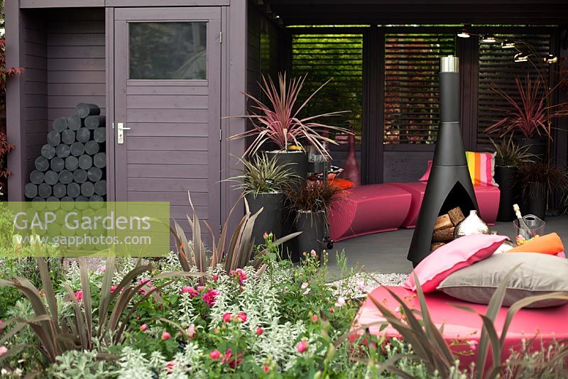 Modern Summer house with chiminea. Chelsea Flower Show 2013