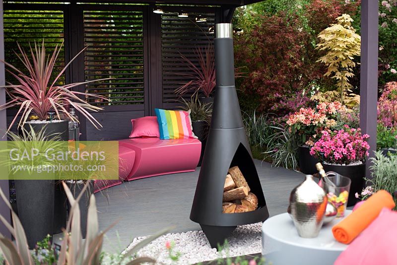 Modern outdoor living area with wood burning chiminea - Hillier Nurseries stand, RHS Chelsea Flower Show 2013