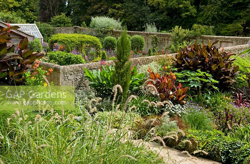 Walled garden with tropical planting 