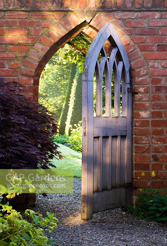 Gothic style wooden gate leading to the Yew walk 