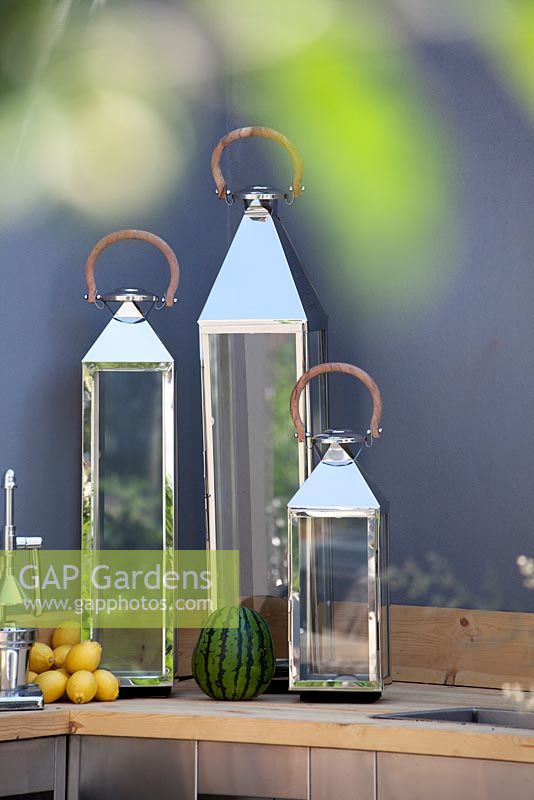 Decorations in modern outdoor kitchen. Vestra Wealth's Jardin du Gourmet. RHS Hampton Court Flower Show 2013. Silver Gilt winner
