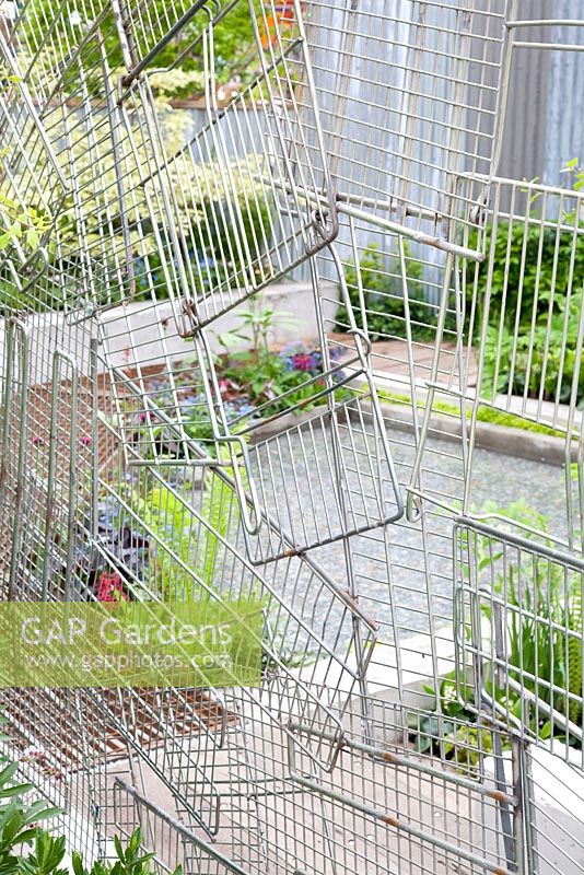 Screen made of recycled shopping trolleys. The Wasteland. Chelsea Flower Show 2013