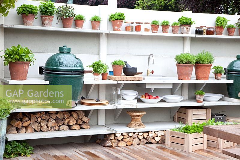Outdoor kitchen with barbeque. Big Green Egg Garden. Chelsea Flower Show 2013