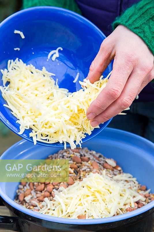 Adding grated cheese to mixture