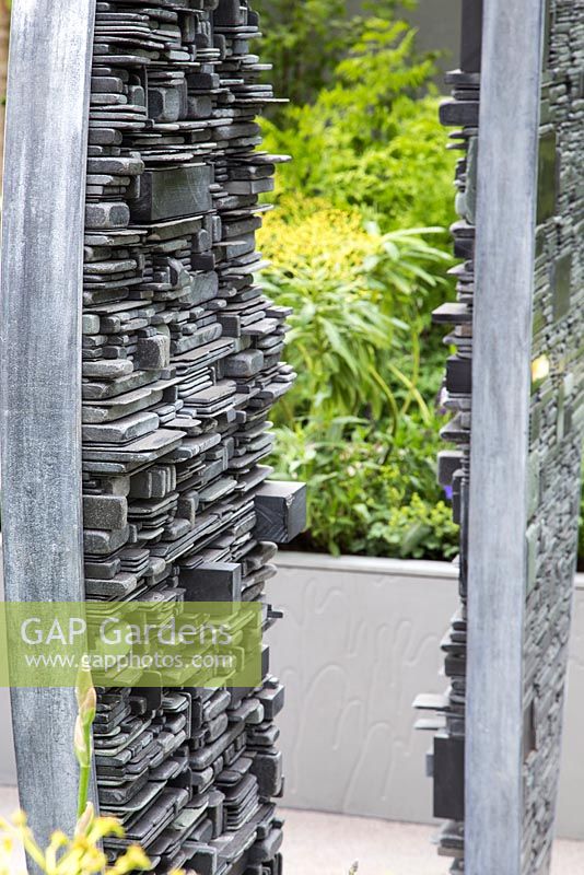 Slate sculpture made by Tom Stogdon. Show Garden: Stop the Spread. 