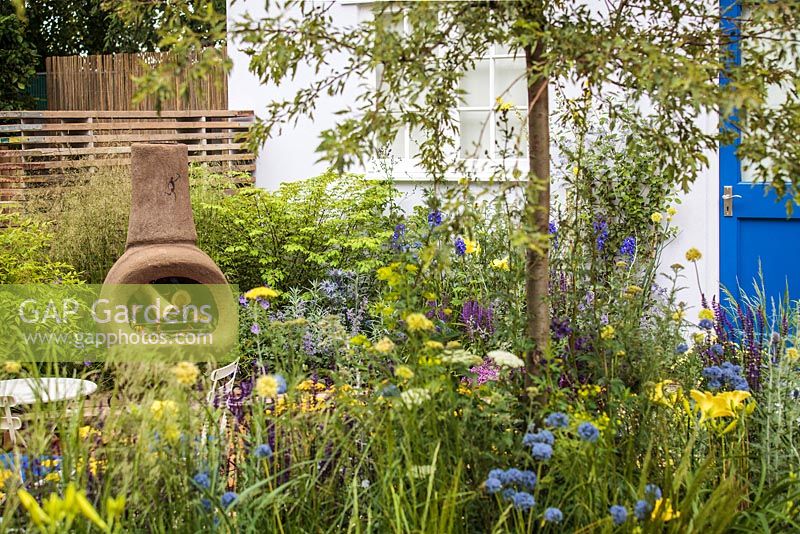 Mixed planting and open fire chiminea - 'Our First Home, Our First Garden' (Low Cost, High Impact Garden), RHS Hampton Court Palace Flower Show 2012