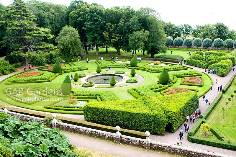 Formal parterre garden set around a circular pool with a fountain at Dunrobin Castle, Sutherland, Scotland