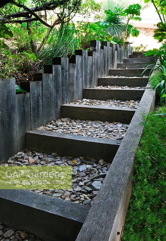 Steps of black woode and stone chippings 