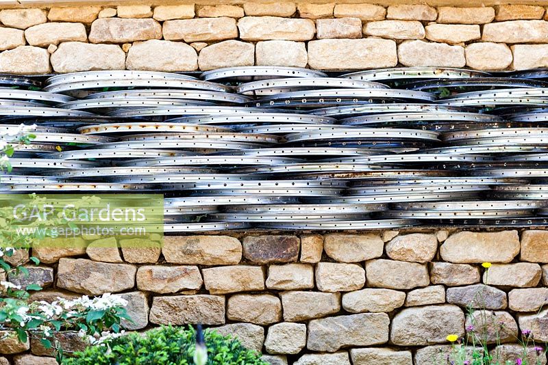 Drystone wall with bicycle wheel rims. Tour de Yorkshire, RHS Chelsea Flower Show 2014
