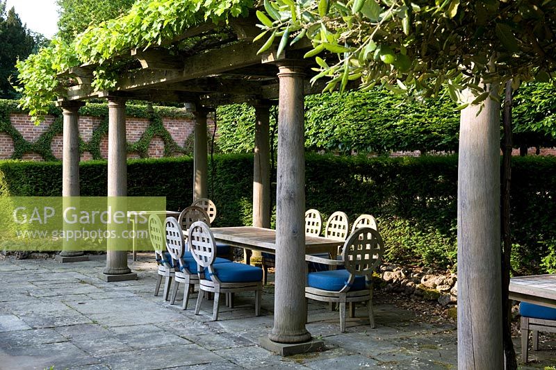 Recreation of Italianate loggia with grape vines and shaded seating Seend, Wiltshire