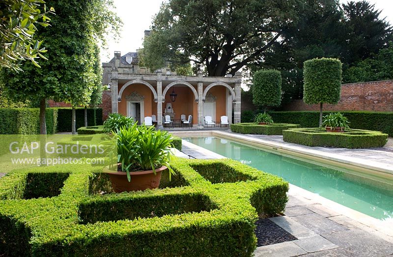 Italianate formal garden with box parterre, loggia and swimming pool. Seend, Wiltshire