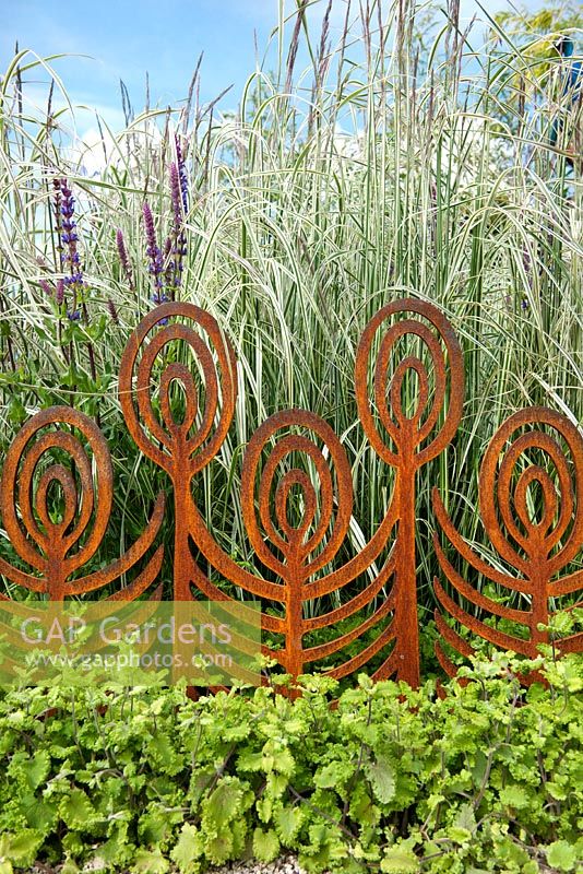 Rusted steel barrier within border of ornamental grasses. Concept Garden. Best in Category Winner at Bloom Garden Festival Ireland 2014. 
