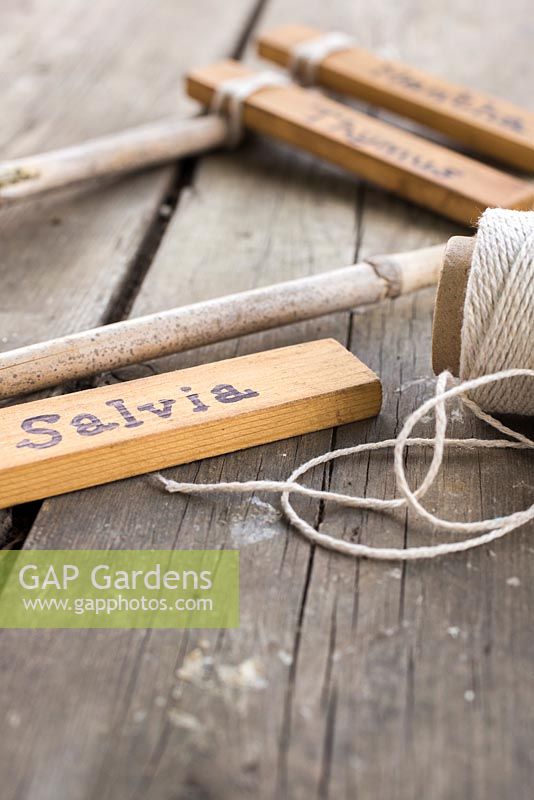 Using small blocks of wood, small parts of a garden cane and string to create trendy plant labels. 