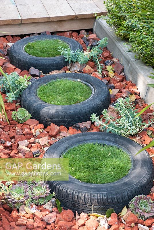 Grass stepping stones made from recycled tyres