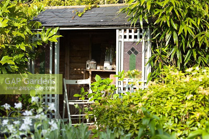 The summer house in the secret garden. Hope House Garden, Caistor, Lincolnshire, UK. April 2014.