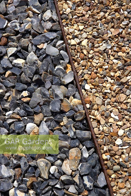 Flint and gravel path with border edge - The Flintknapper's Garden-A Story of Thetford. Designer: Luke Heydon. Sponsors: Businesses in and around Thetford - RHS Hampton Court Palace Flower Show 2014 