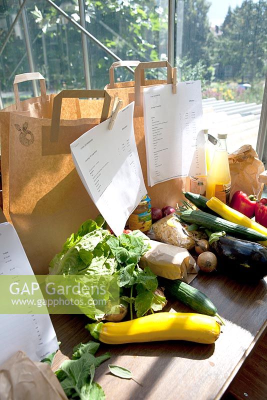 Fresh vegetables and other ordered foods in paper bags. PUURLAND is web shop to order local food.