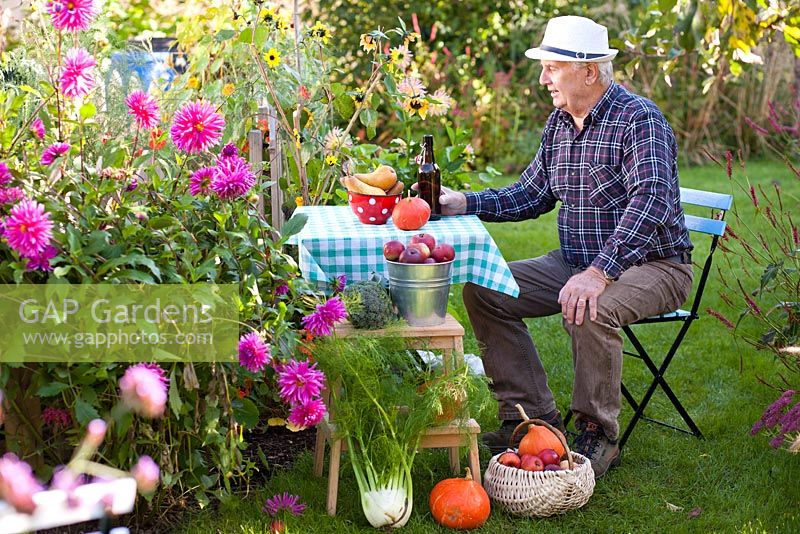 Man relaxing in the garden after harvesting.