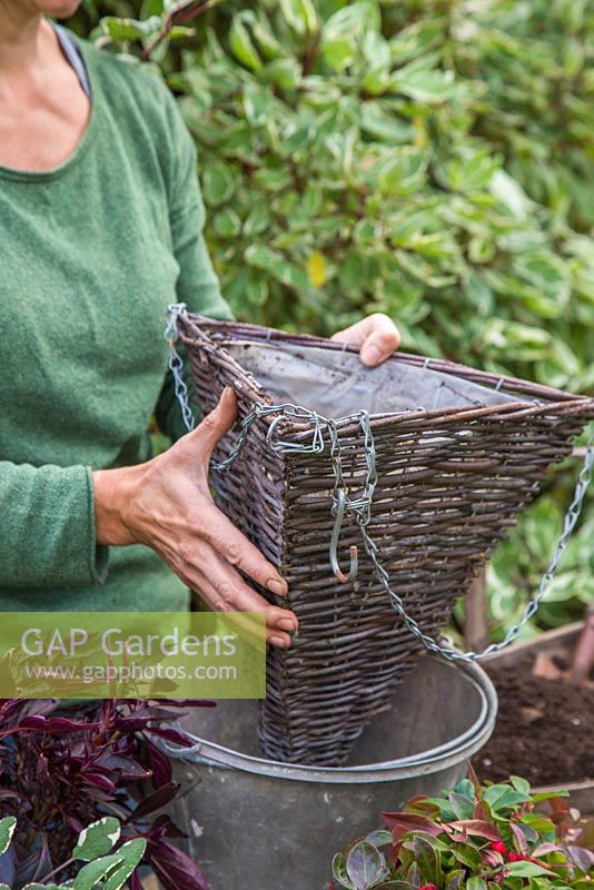 Placing basket in a bucket to add support whilst planting up.