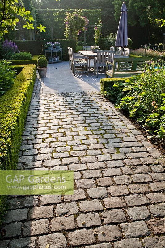 Granite setts path to the dinning area on patio.