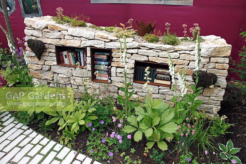 Dry stone wall with bookshelf - perennial border, June, Sigmaringen, Germany