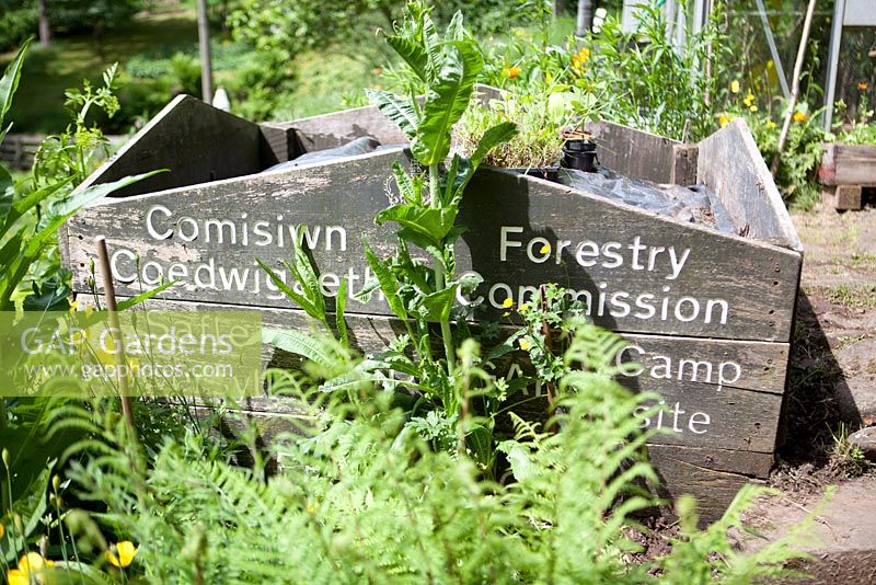 Re-using signs for a compost bin