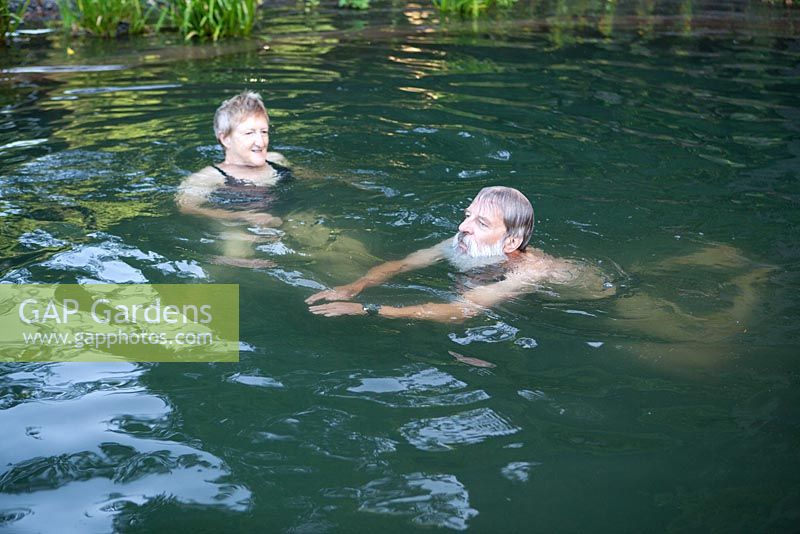 Couple swimming in their natural swimming pond - Sue and Ian Mabberley