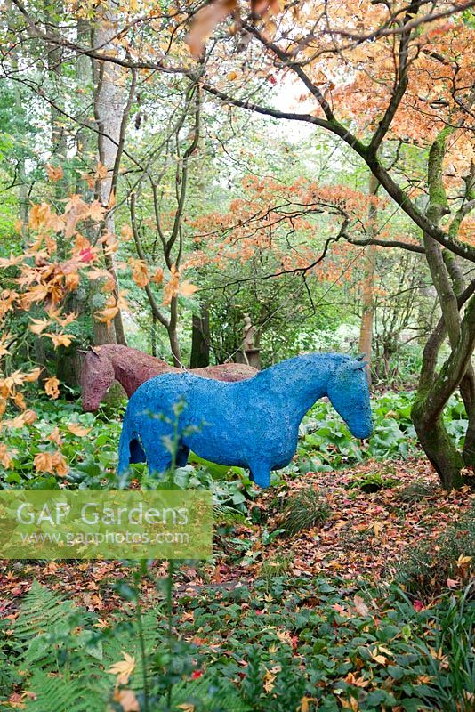 Swaying Horses by Alison Berman made from fibreglass and resin. The Hannah Peschar Sculpture Garden designed by Anthony Paul, landscape designer