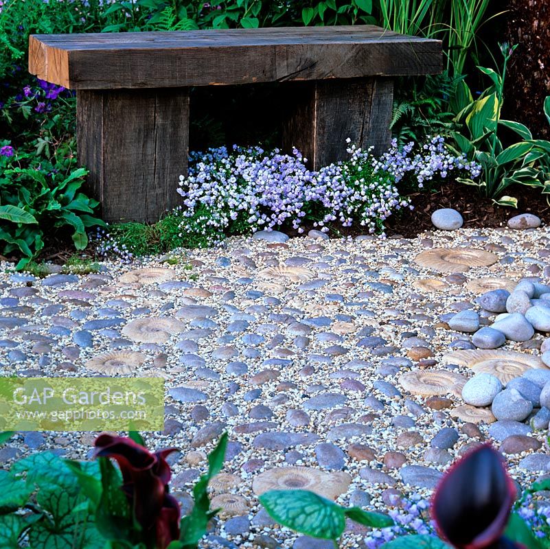 Path created from pebbles and ammonites cast in reconstituted stone, set in small pebbles.