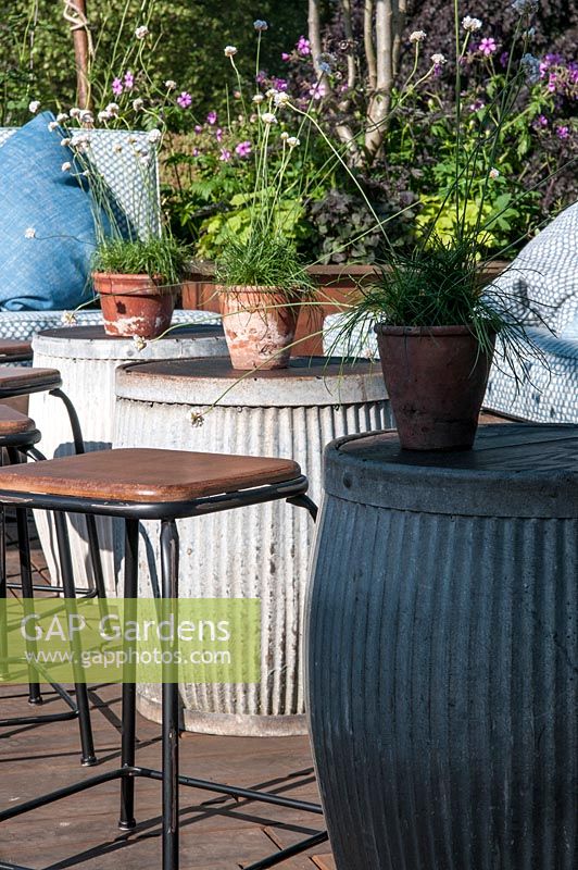 Garden table made from galvanized drums.