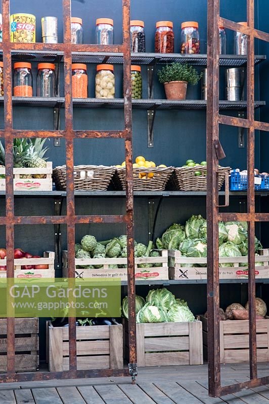 Open air pantry for storing fresh veg and jars of pickles.