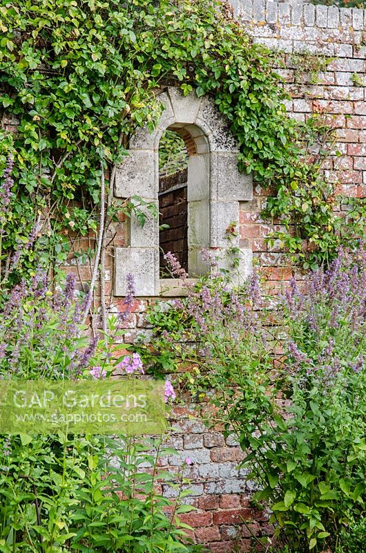 Window through wall of kitchen garden