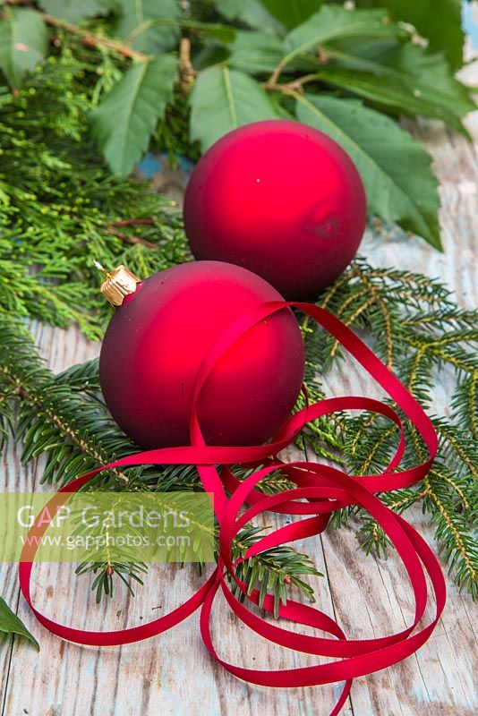 Red baubles with Ribbon, cedar and yew foliage