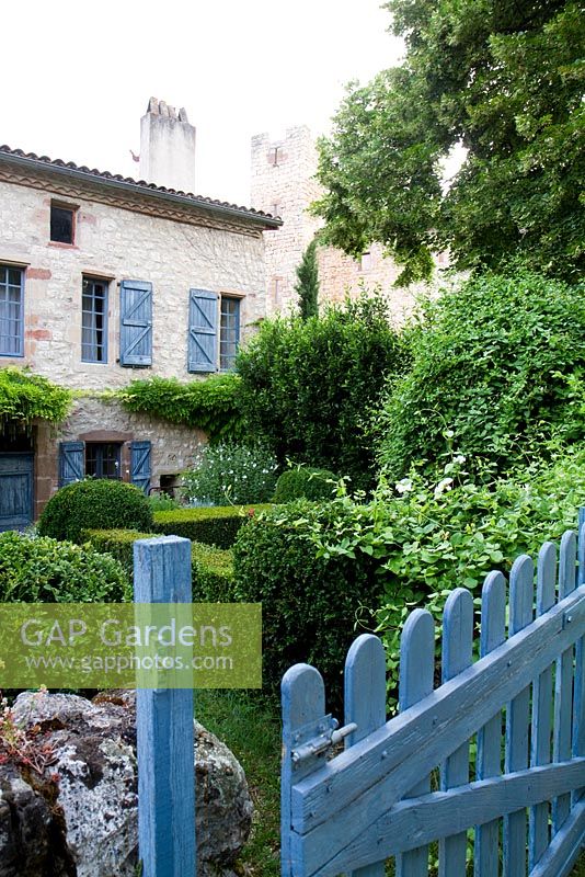 Wisteria clad stone cottage. Part of the property and garden at Domaine de Chatelus de Vialar.