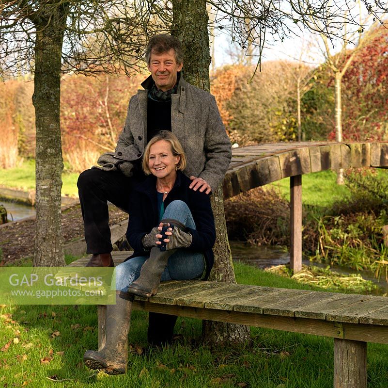 Rupert and Elizabeth Nabarro in their garden, which sits on the banks of the River Test.