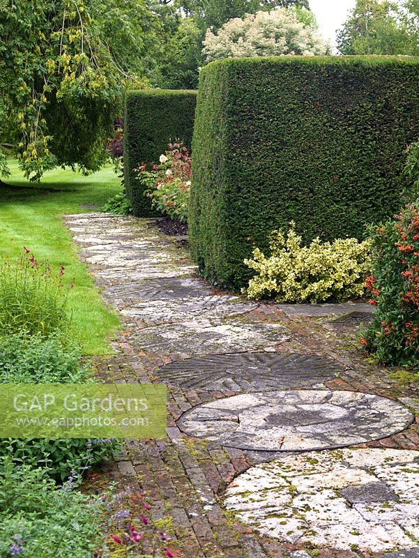 Path created from old circular mill stones and bricks.