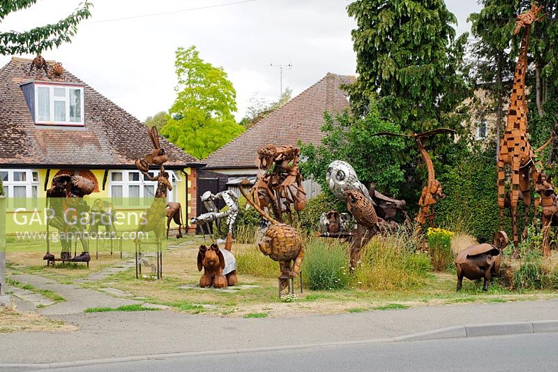 Metal animal sculptures in the front garden of a house at Histon near Cambridge. Folk art.