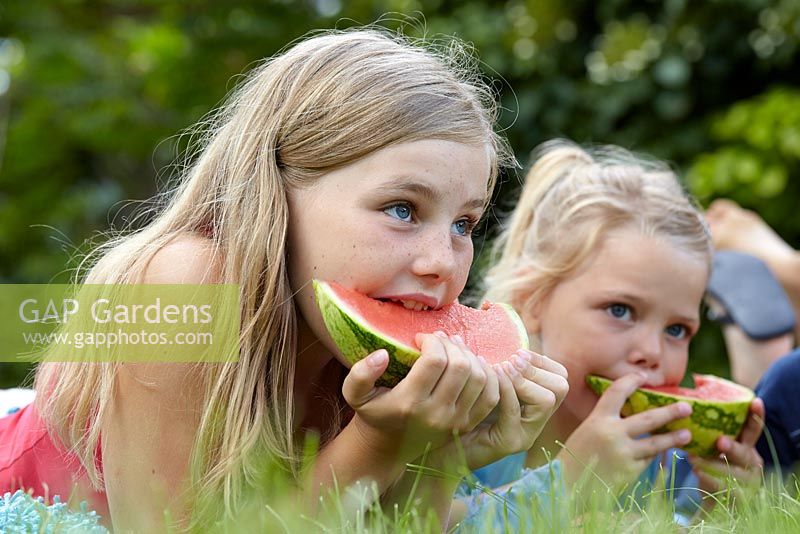 Girls eating watermelon