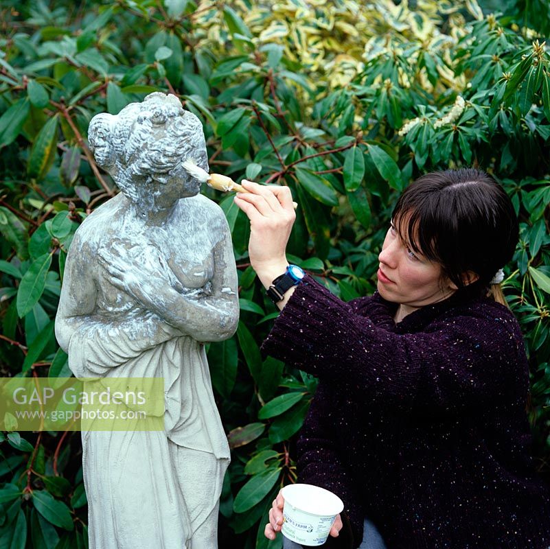 Live yoghurt is being painted onto a new reproduction statue, cast in concrete, to encourage lichen growth.