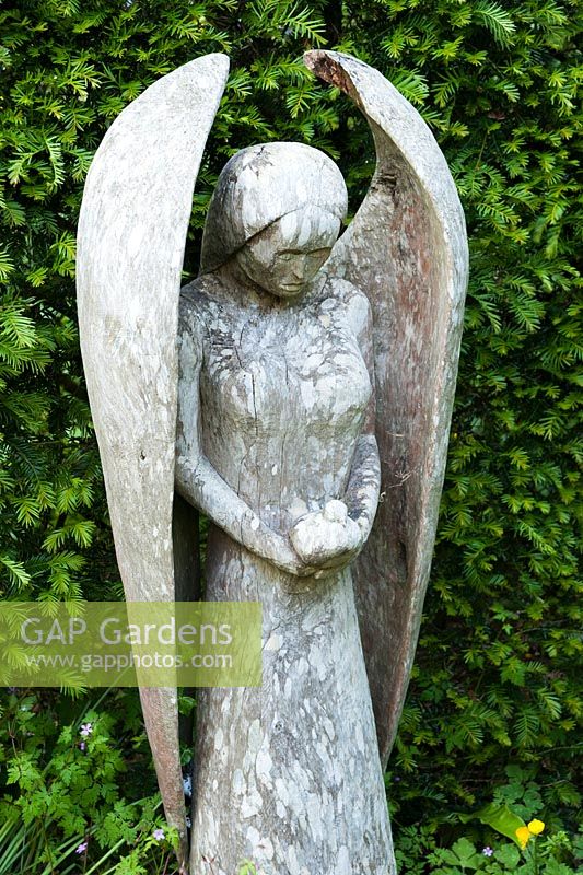 Wooden angel carved by John Aulman. Caervallack Farm, nr Helston, Cornwall, UK