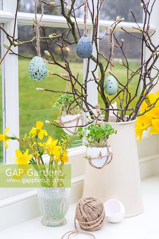 Egg Shell Cress hanging in a rustic string satchel, amongst an Easter setting. 