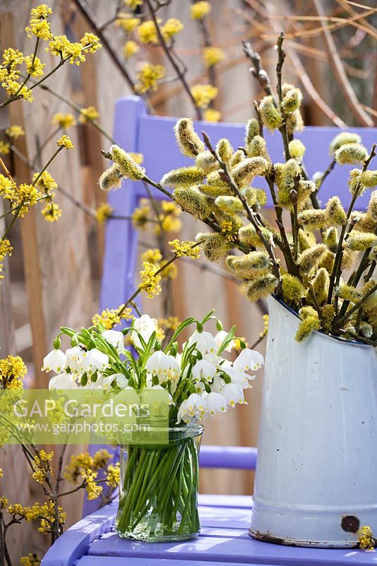 Spring arrangements with catkins and snowflakes.