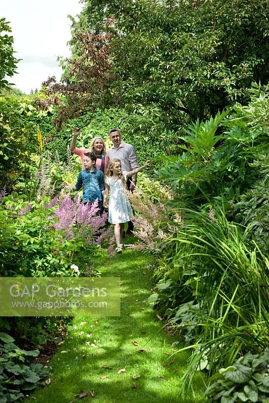 Family enjoying a day out at Carolside Garden, Earlston, Berwickshire, Scotland