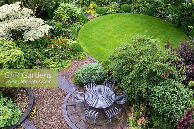 An overhead view of Windy Ridge garden which is laid out with circular lawn, patio and raised beds.