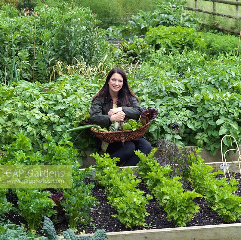 Rachel de Thame harvesting produce from her country vegetable garden.