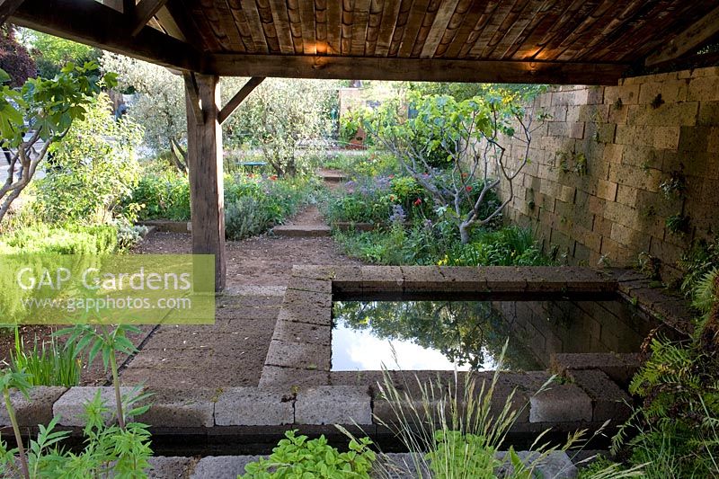 A Perfumer's Garden in Grasse. Recreation of Lavoir building in natural wild garden. 