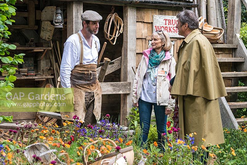 Charlie Groves, a Sussex Trug basket maker, chatting to Alan Titchmarsh.  A Trugmaker's Garden, RHS Chelsea Flower Show, 2015