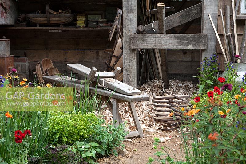 The Trugmaker's Garden, detail of workbench and planting.  RHS Chelsea Flower Show, 2015