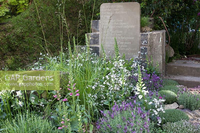 Stone water trough, mixed planting and grave stones - The Evaders Garden, RHS Chelsea Flower Show, 2015